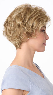 Model is wearing BRYN by ENVY in color DARK BLONDE | 2 toned blend of Dark Honey Blonde with Lighter Blonde highlights