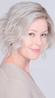 A fusion of a short-stacked bob wig and a feminine boy cut with textured sides