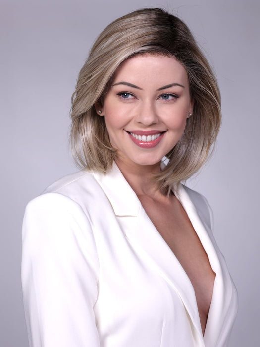 Model is wearing CARDIFF in  MILKSHAKE BLONDE R | A mixture of Light Sandy Brown, Highlighted with Light Ash Blonde with a Hint of Light Platinum Blonde with a Medium Root Color