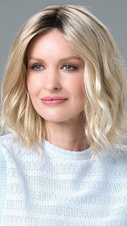 Model is wearing Charlotte Large by ENVY in color SILKY BEIGE |  Light Platinum Blonde with Dark Brown Roots