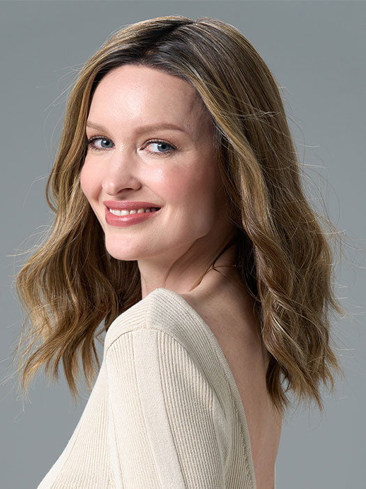 Model is wearing COREY by ENVY in HONEY BREEZE | A blend of Cool, Honey Blonde and Multi-Dimensional Medium Brown with Darker Brown Roots