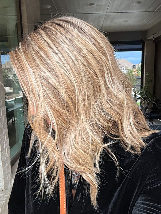 Jenny B. @thewiggygirl wearing COREY by ENVY in color SPARKLING CHAMPAGNE | Medium Brown roots with overall Strawberry Blonde base and soft Golden Blonde highlights