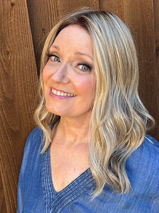 Mel B. @mels.be.ageless wearing Corey by Envy in shade CHAMPAGNE SHADOW | Soft Dark Blonde with Platinum Highlights and Chestnut Roots