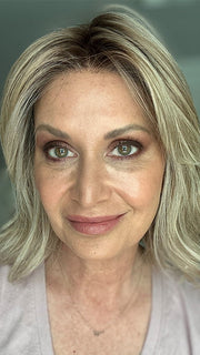 Emily H. @she_sheds_more wearing CYRUS by BELLE TRESS in color BUTTERCAKE BLONDE-R | A neutral-warm blonde blend featuring light brown, ash, and lightest blonde tones with natural-looking darker roots for added depth and realism.