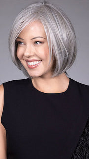 Model is wearing DION in color COCANUT MILK GREY R | Creamy, off-white tones with soft gray hues, creating a pearlescent or silvery finish.