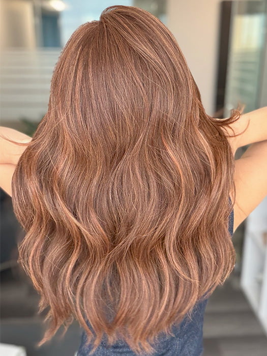 Model is wearing DECADENT DIVA by RAQUEL WELCH in shade RL32/31 CINNABAR | Medium Dark Auburn Evenly Blended with Medium Light Auburn