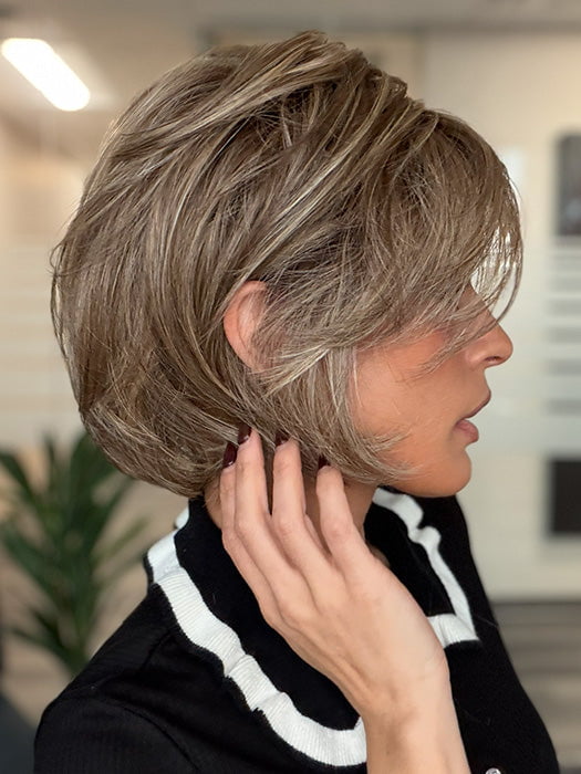 Model is wearing EFFORTLESS STYLE by RAQUEL WELCH in color SS11/25 SHADED HONEY PECAN | Chestnut Brown base blends into multi-dimensional tones of Brown and Golden Blonde