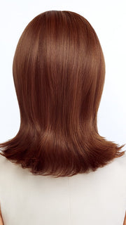 Model is wearing FEATHERED BOB by TRESSALLURE in color 27/30/33H | Auburn blend highlighted
