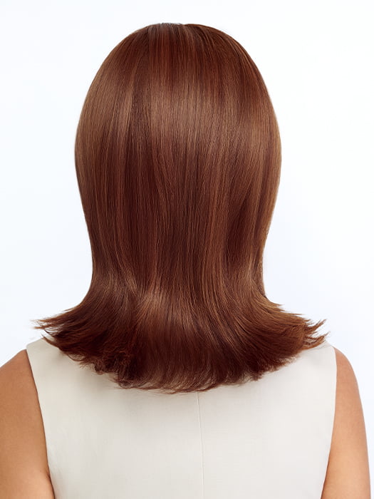 Model is wearing FEATHERED BOB by TRESSALLURE in color 27/30/33H | Auburn blend highlighted