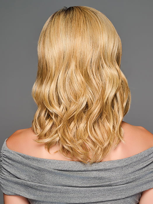 Model is wearing RAISE THE BAR in color GF14-22SS SS WHEAT| Dark Blonde Evenly Blended with Platinum Blonde with Dark Roots