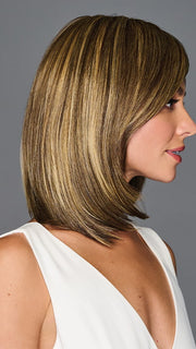 Model is wearing ILLUMINATION by GABOR in color BROWN-BLONDE | Medium to Light Brown with Salon Highlights