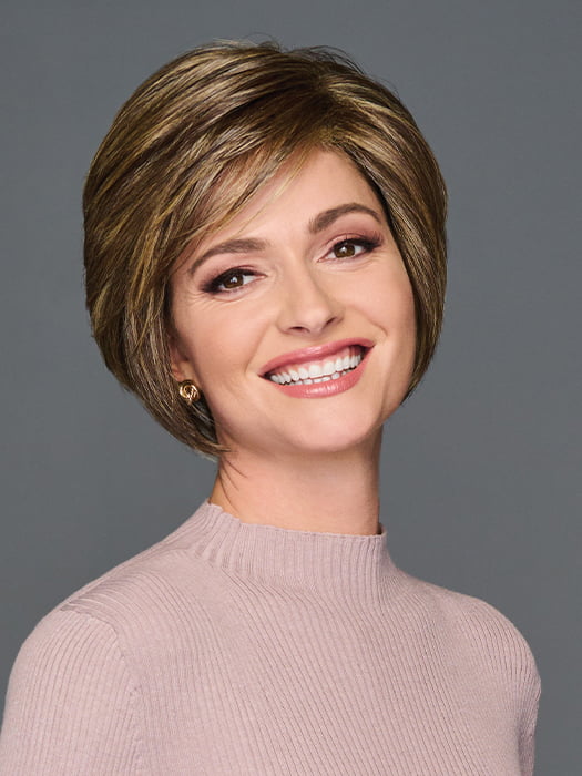 Model is wearing WONDERFUL WIT by GABOR in color BROWN-BLONDE | Medium to Light Brown with Salon Highlights