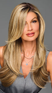 Model is wearing STAY OUT LATE in color GF12-22SS SS SHADED CAPPUCCINO | A radiant blend of warm blonde tones with sunlit highlights and soft dimension