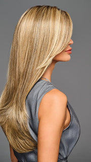 Model is wearing STAY OUT LATE in color GF12-22SS SS CAPPUCCINO | A radiant blend of warm blonde tones with sunlit highlights and soft dimension