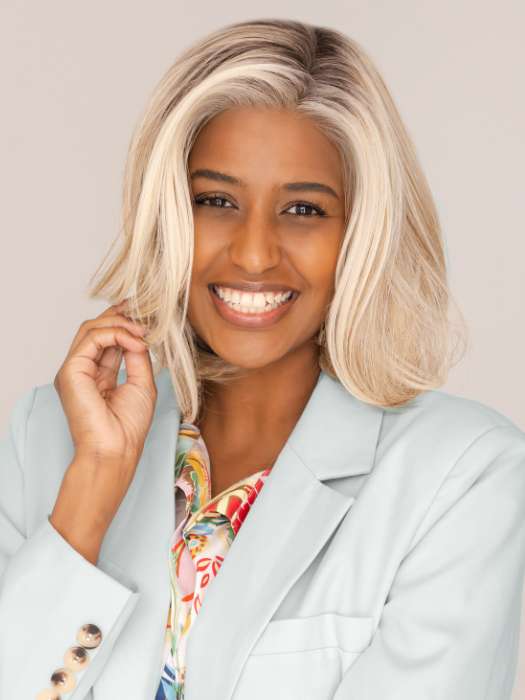 Model is wearing HAUTE by JON RENAU in color 101/88/27S8 CATALINA BLONDE | Pale blonde with Pure White Natural Violet halo highlights, shaded medium brown