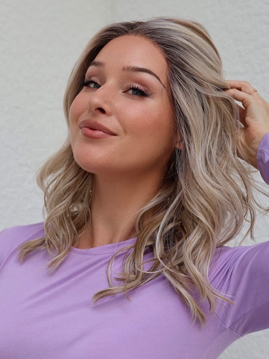 Heather @cjswigs wearing LAGUNA BEACH by BELLE TRESS in color MILKSHAKE BLONDE R | A mixture of Light Sandy Brown, Highlighted with Light Ash Blonde with a Hint of Light Platinum Blonde with a Medium Root Color