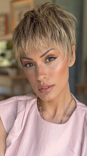 Roxie is wearing IRIS by JON RENAU in color 24BT18S8 SHADED MOCHA | Medium Natural Ash Blonde & Light Natural Gold Blonde Blend, Shaded with Medium Brown