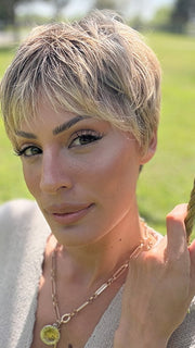 Roxie is wearing IRIS by JON RENAU in color 24BT18S8 SHADED MOCHA | Medium Natural Ash Blonde & Light Natural Gold Blonde Blend, Shaded with Medium Brown