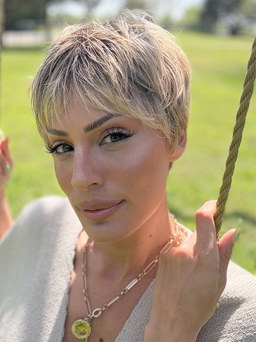 Roxie is wearing IRIS by JON RENAU in color 24BT18S8 SHADED MOCHA | Medium Natural Ash Blonde & Light Natural Gold Blonde Blend, Shaded with Medium Brown