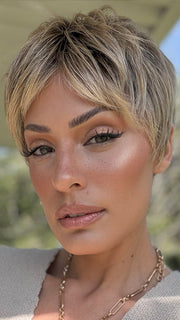 Roxie is wearing IRIS by JON RENAU in color 24BT18S8 SHADED MOCHA | Medium Natural Ash Blonde & Light Natural Gold Blonde Blend, Shaded with Medium Brown