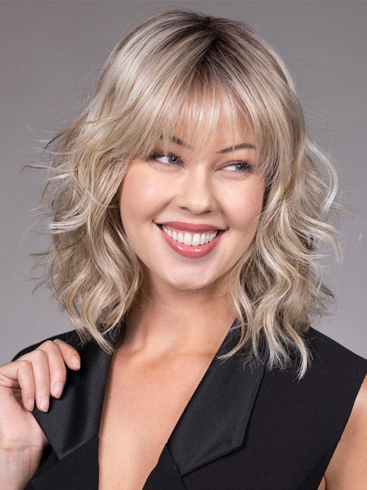 Model is wearing JIL in BUTTERBEER R | Dark Brown Base and Root that transitions smoothly into a buttery blonde, infused with creamy honey and toffee tones
