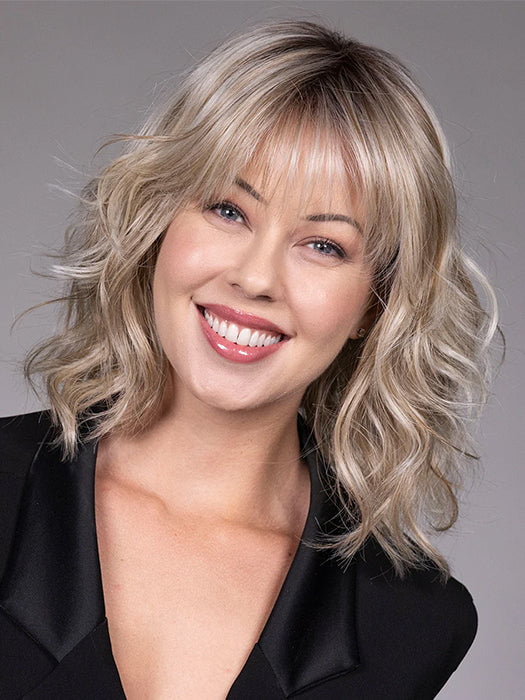 Model is wearing JIL in BUTTERBEER R | Dark Brown Base and Root that transitions smoothly into a buttery blonde, infused with creamy honey and toffee tones