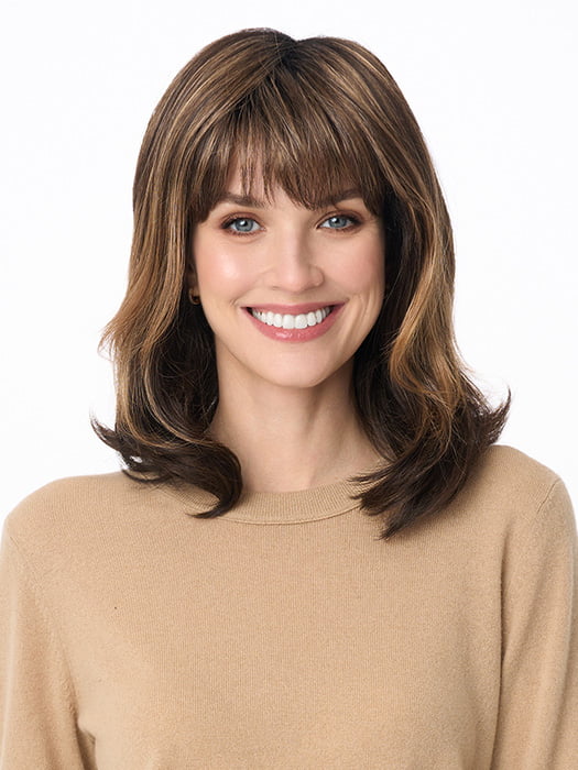 Model is wearing JOLIE by ENVY in color AMARETTO-CREAM | Dark Brown roots with overall Medium Brown base with Honey Blonde highlights