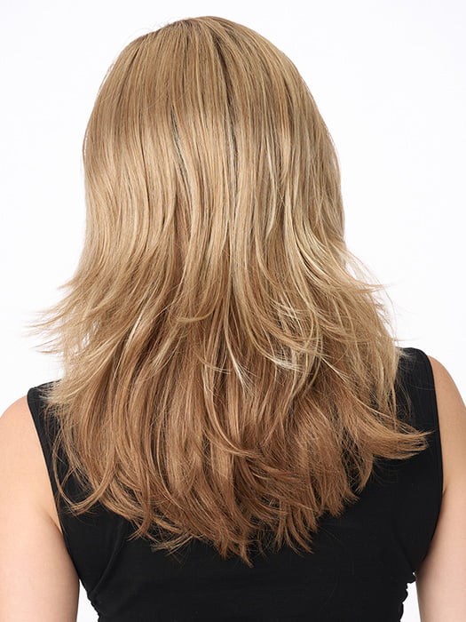 Model is wearing JOY by ENVY in color SPARKLING-CHAMPAGNE | Medium Brown roots with overall Strawberry Blonde base and soft Golden Blonde highlights
