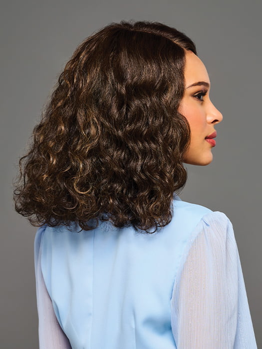 Model is wearing SHANTE by KIM KIMBLE in color MC4/10SS ESPRESSO MARTINI | Dark Brown with Lighter Brown Highlights