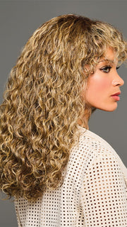Model is wearing ZARIYA by KIM KIMBLE in color MC11SS BUTTER PECAN | Medium Brown with Golden Blonde Highlights