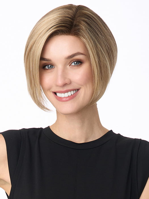 Model is wearing KARI by ENVY in color SPARKLING CHAMPAGNE | Medium Brown roots with overall Strawberry Blonde base and soft Golden Blonde highlights