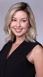 Model is wearing MANHATTAN by BELLETRESS in color CRUSHED-ALMOND-BLONDE-R | A soft Neutral Light Blonde with a Light and Medium Blended Root Color