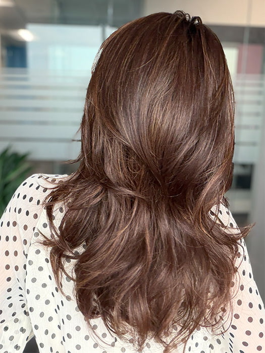 Roxie is wearing MARGO in color GLAZED AUBURN R | Stunning fusion of deep red, medium copper, and dark chocolate root.