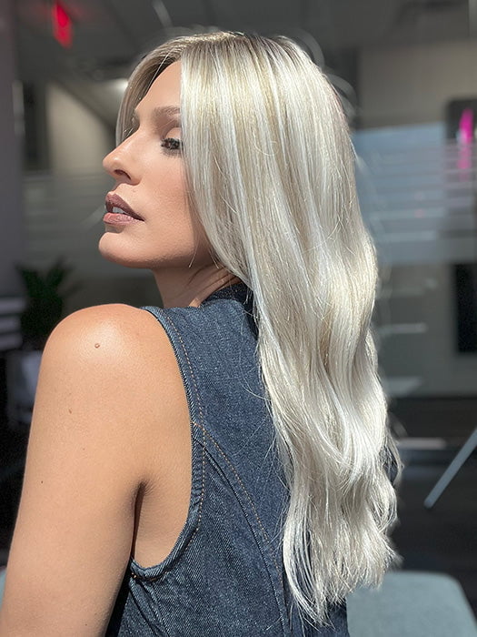 Model is wearing OLIVIA by JON RENAU in color FS17/101S18 PALM SPRINGS BLONDE | Light Ash Blonde with Pure White Natural Violet Bold Highlights, Shaded with Dark Natural Ash Blonde 
