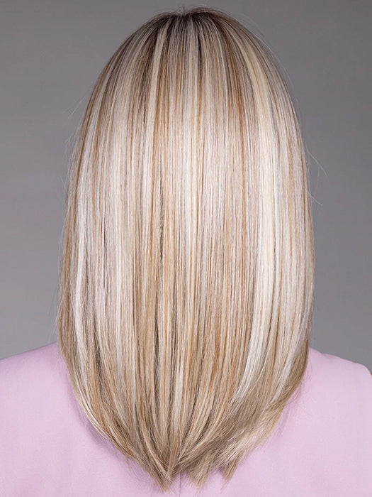Model is wearing PIANA in color BUTTERBEER |  A rich blend of warm brunette and golden honey highlights finished with a soft, natural root.
