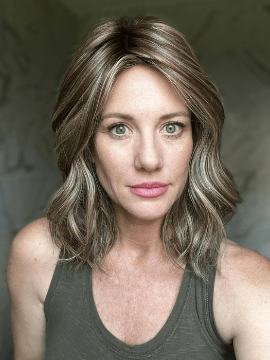 Jenny B. @thewiggygirl wearing WAVY DAY by RAQUEL WELCH WIGS in color RL9/24SS ICED CAFÉ LATTE | Dark Brown shaded with Golden Brown
