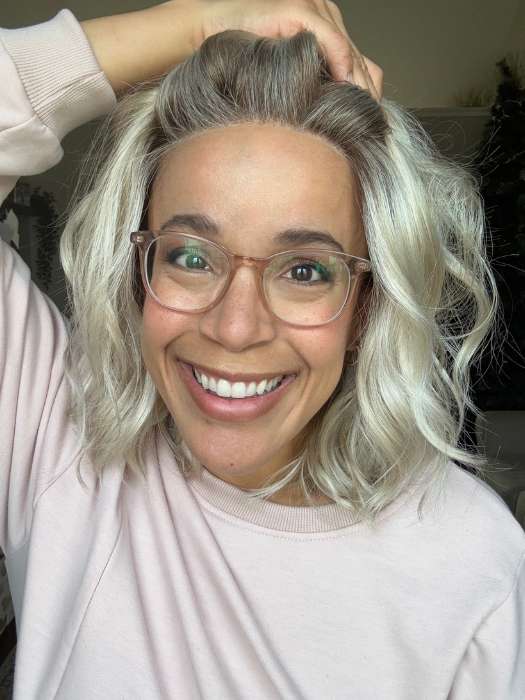 Brea @getwiggywithbrea wearing ARLO by ESTETICA in color SUNLIT-BLONDE | Soft Blend of Sandy Blonde, Lightest Blonde and Iced Blonde with a Light Golden Brown Root
