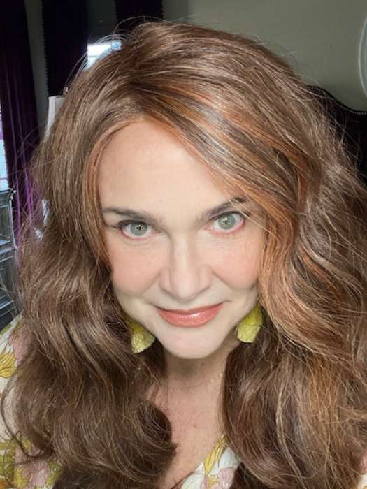 Tonya wearing DAY TO DATE by RAQUEL WELCH WIGS in color RL32/31 CINNABAR | Medium Dark Auburn Evenly Blended with Medium Light Auburn
