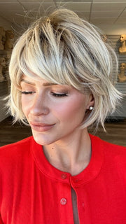 Madeline wearing TOLEDO by BELLETRESS in CRUSHED ALMOND BLONDE R | A soft Neutral Light Blonde with a Light and Medium Blended Root Color.
