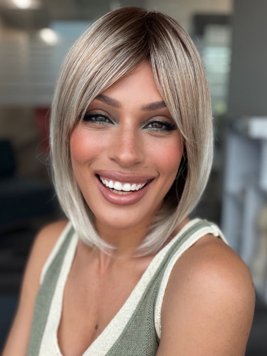 Roxie wearing ALVA by NORIKO in MELTED-MARSHMALLOW | Subtly Warm Dark Sandy Blonde Blend with Medium Brown Roots and Light Ash Blonde Tips and Highlights