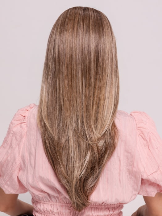 Roxie wearing KATNISS by BELLETRESS in BROWN SUGAR BLONDE-R | A warm, dimensional blend of medium brown and golden blonde highlights with natural-looking darker roots for depth and a sun-kissed finish.