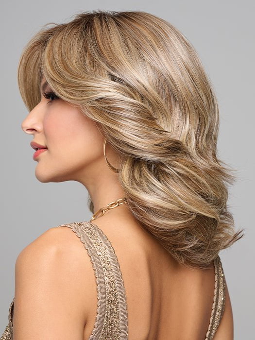 This layered hairstyle has feathery edges and forms V-shape at back