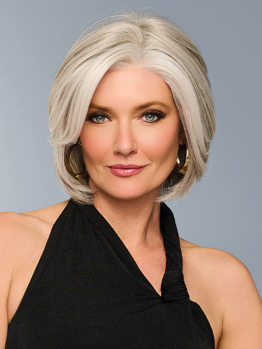 Model is wearing TAILORED ALLURE in color RL51/61 ICED GRANITA | Lightest Grey Progresses to a Deep Grey at the Nape