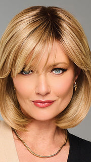 Model is wearing TIMELESS CHARM by RAQUEL WELCH in color  RL14/22SS SHADED WHEAT | Dark Blonde Evenly Blended with Platinum Blonde with Dark Roots