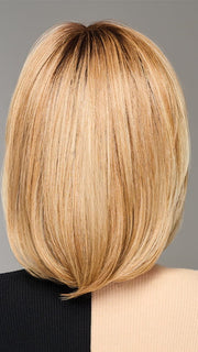 Model is wearing TIMELESS CHARM by RAQUEL WELCH in color  RL14/22SS SHADED WHEAT | Dark Blonde Evenly Blended with Platinum Blonde with Dark Roots