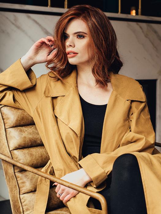 SIMMER ELITE PETITE by RAQUEL WELCH in RL32/31 CINNABAR | Medium Dark Auburn Evenly Blended with Medium Light Auburn (Model is wearing Simmer with a wefted back)