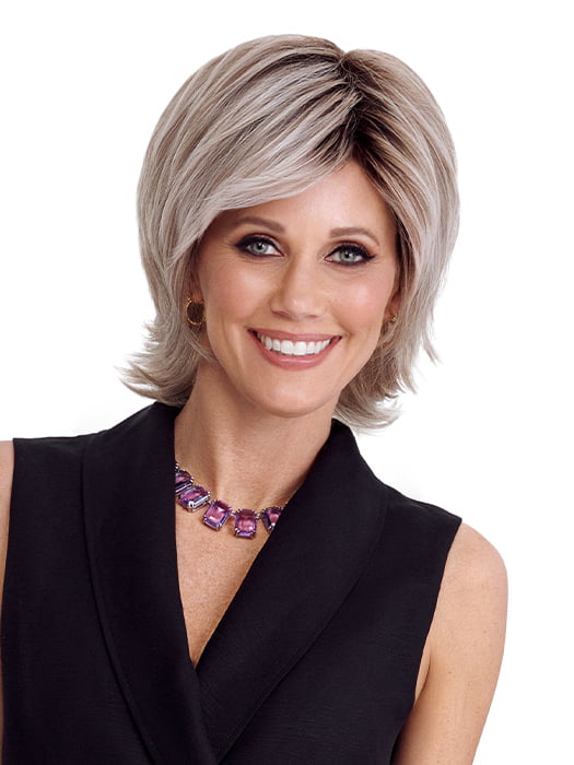 Model is wearing RAZOR CUT SHAG by TRESSALLURE in color 56/60/R8 | Lightest Grey Blend Rooted Medium Brown
