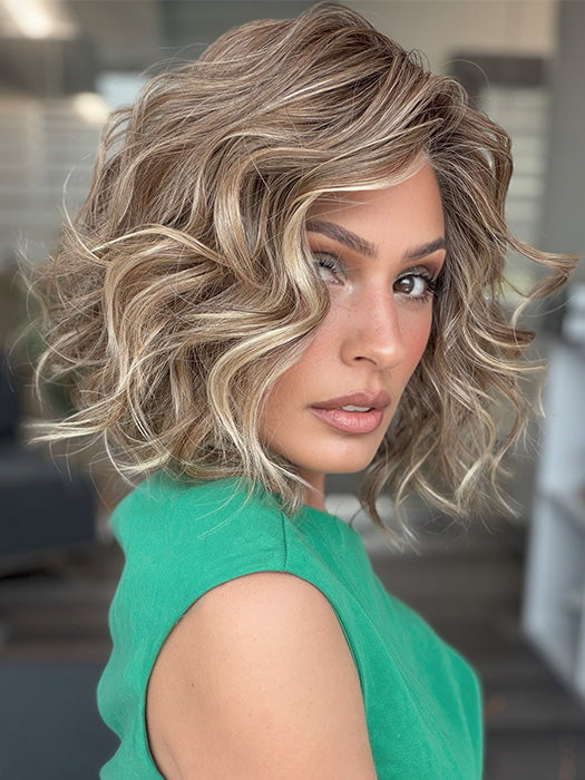 Model is wearing ROMANTIC RENAISSANCE by RAQUEL WELCH in color SS12/22 SHADED CAPPUCCINO | Light Golden Brown Evenly Blended with Cool Platinum Blonde Highlights and Dark Roots