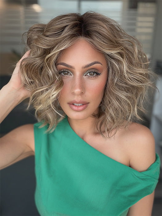 Model is wearing ROMANTIC RENAISSANCE by RAQUEL WELCH in color SS12/22 SHADED CAPPUCCINO | Light Golden Brown Evenly Blended with Cool Platinum Blonde Highlights and Dark Roots