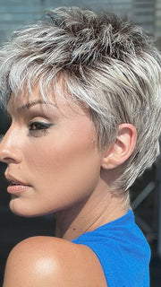 Model is wearing CHAT by ELLEN WILLE in color PEARL ROOTED | Pearl Platinum with Medium Ash Blonde and Lightest Brown with Grey Blend and Shaded Roots